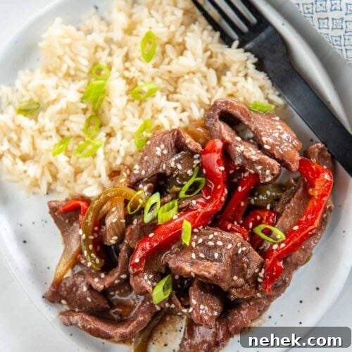 slow cooker pepper steak served on plate