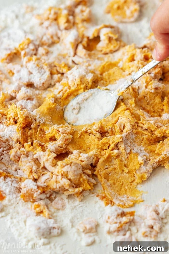 Homestyle Pumpkin Flatbread Recipe for Fall Gatherings 4 Mixing flour and pumpkin puree together to make dough.