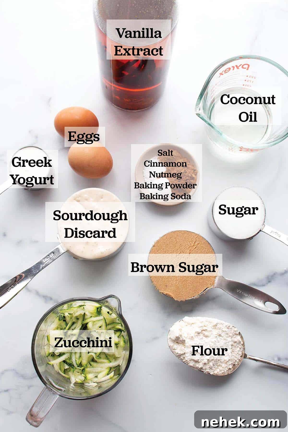 Moist Sourdough Zucchini Bread Recipe 3 Ingredients prepped in bowls and measuring cups to make zucchini bread.