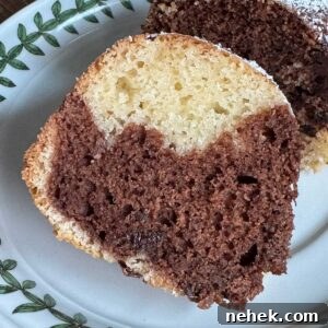 Moist Sour Cream Marble Bundt Cake with Chocolate-Vanilla Swirl 6 Slice of Moist Sour Cream Marble Cake inspired by a recipe in The Settlement Cookbook.