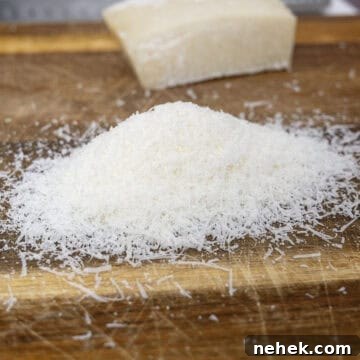 Authentic Bucatini Amatriciana Recipe 4 Pecorino grated on a cutting board.