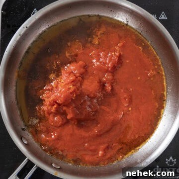 Authentic Bucatini Amatriciana Recipe 8 Whole plum tomatoes added to the oil from guanciale.