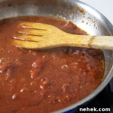 Authentic Bucatini Amatriciana Recipe 9 Black pepper added to the sauce and simmering.