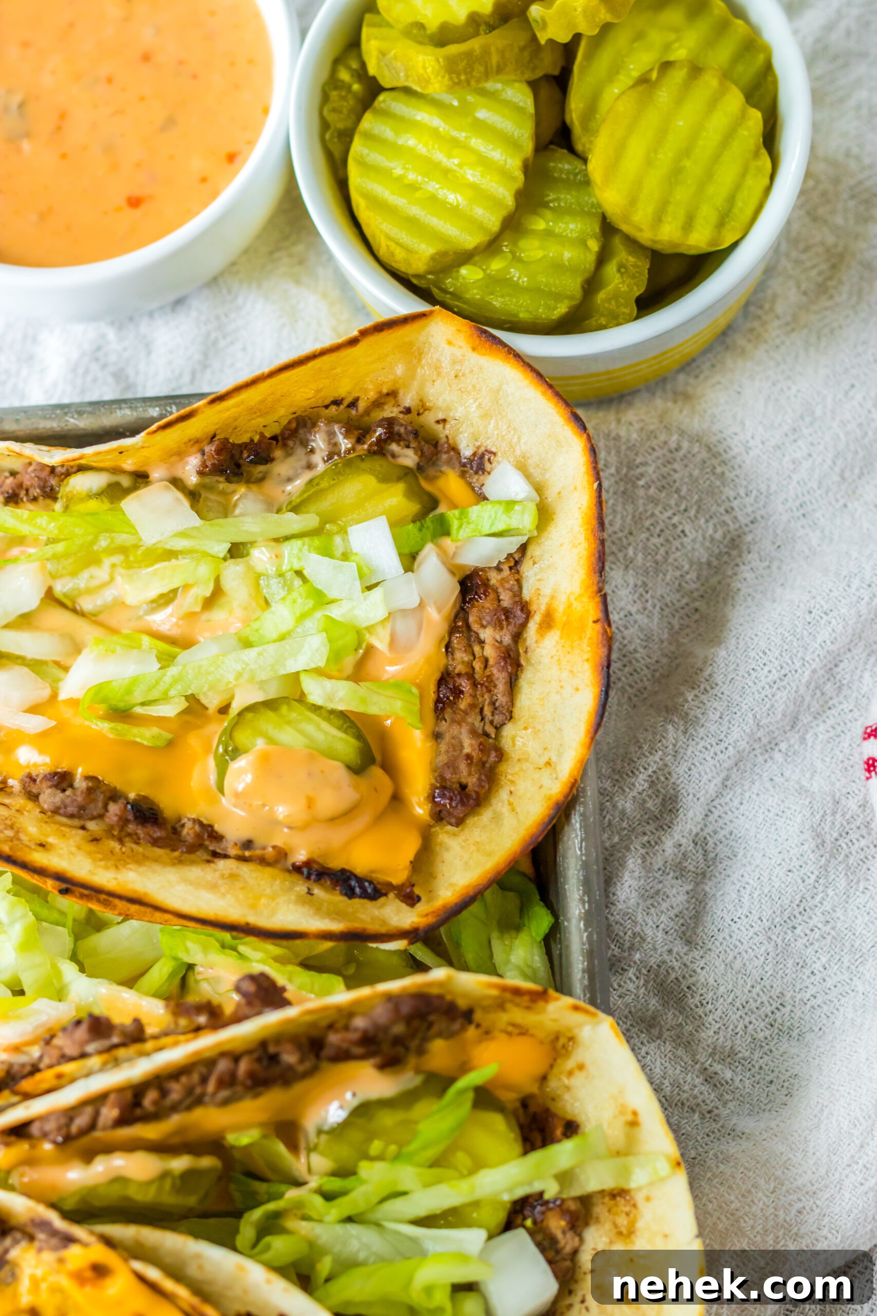 Big Mac Smash Tacos Recipe: Crispy Beef Tacos with Special Sauce 3 Big Mac smash tacos up close showing the texture