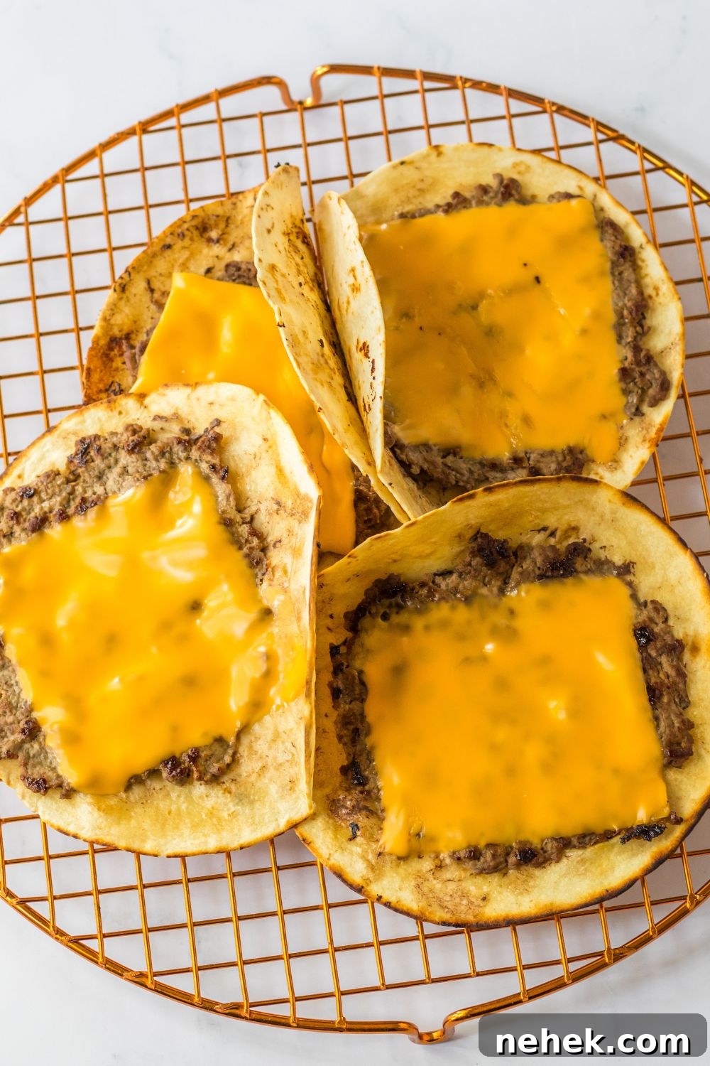 Big Mac Smash Tacos Recipe: Crispy Beef Tacos with Special Sauce 8 smash taco burgers with cheese on top