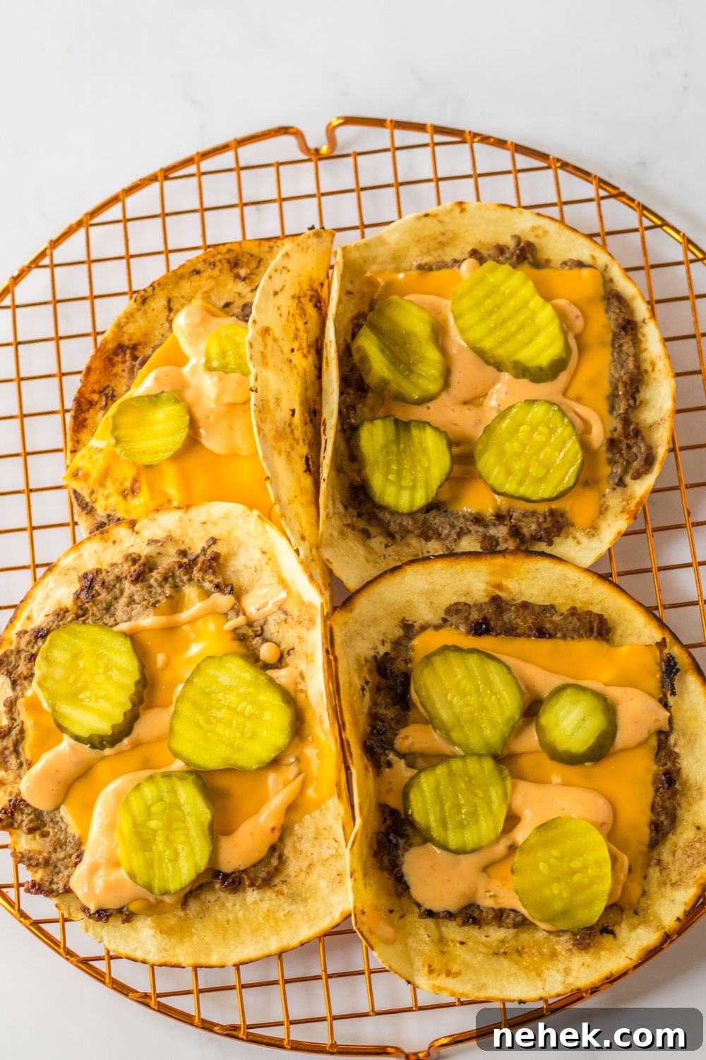Big Mac Smash Tacos Recipe: Crispy Beef Tacos with Special Sauce 9 smash tacos topped with cheese and pickles