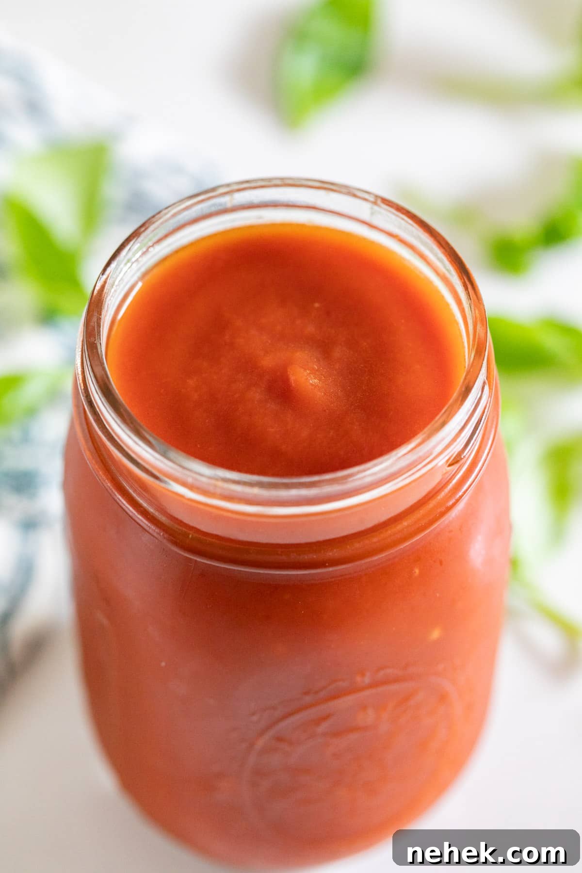 Homemade Sugar-Free Marinara Sauce 3 A close up image of marinara in a jar.