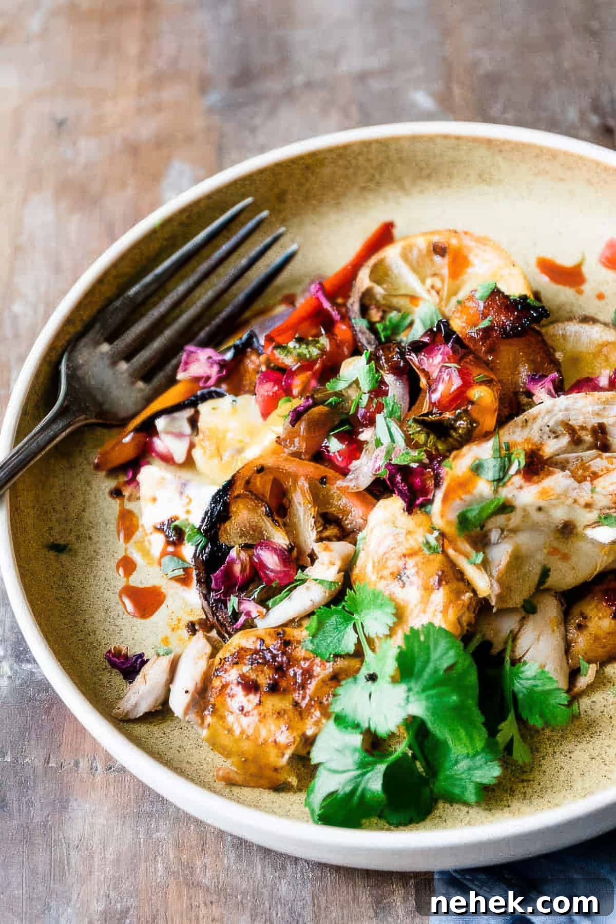 Sheet Pan Harissa Chicken with Crispy Potatoes 3 Harissa chicken with vegetables and potatoes.